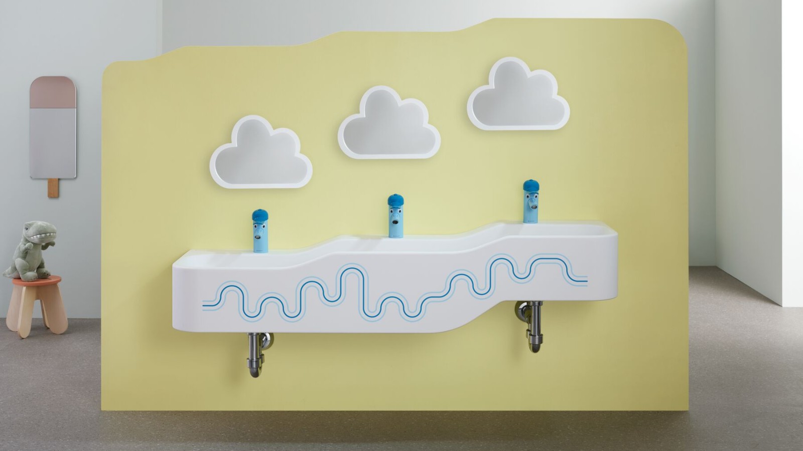 Umywalka dla dzieci Geberit Bambini na tle żółtej ściany Umywalka dla dzieci Geberit Bambini na tle żółtej ściany