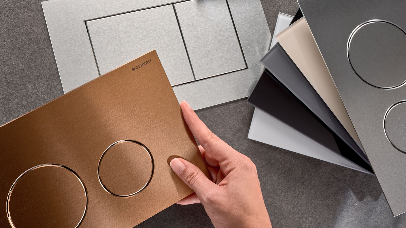 Przyciski spłukujące Geberit Sigma40 w różnych powierzchniach i kształtach