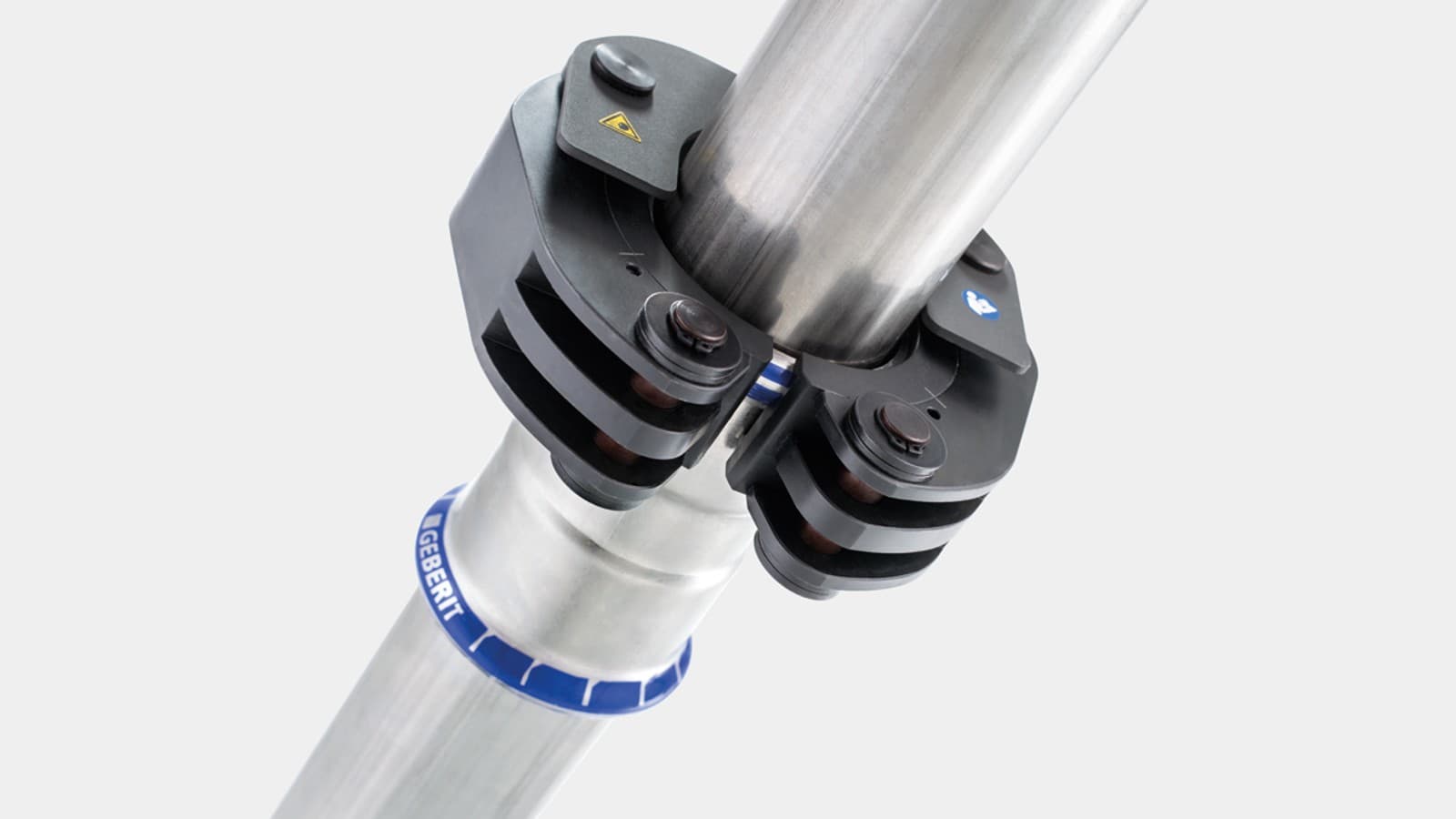 Mechanizm zatrzaskowy mocuje kołnierz zaciskowy Geberit do kształtki Geberit Mapress Mechanizm zatrzaskowy mocuje kołnierz zaciskowy Geberit do kształtki Geberit Mapress